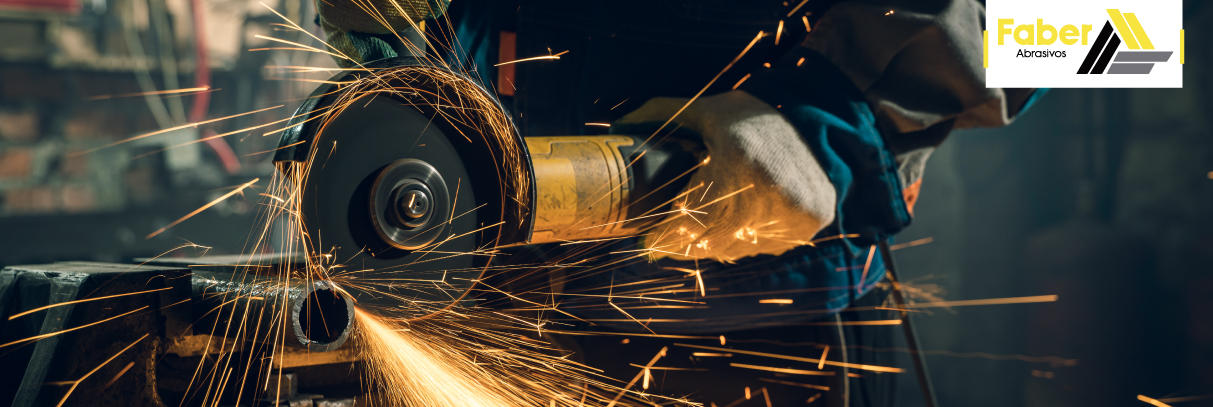 locksmith-in-special-clothes-and-goggles-works-in-production-metal-processing-with-angle-grinder